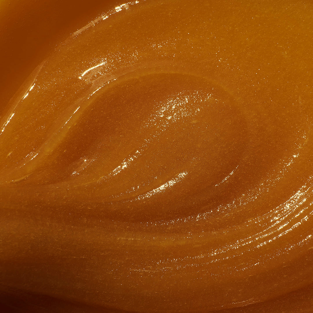 Close-up of a smooth, brown surface with a glossy finish