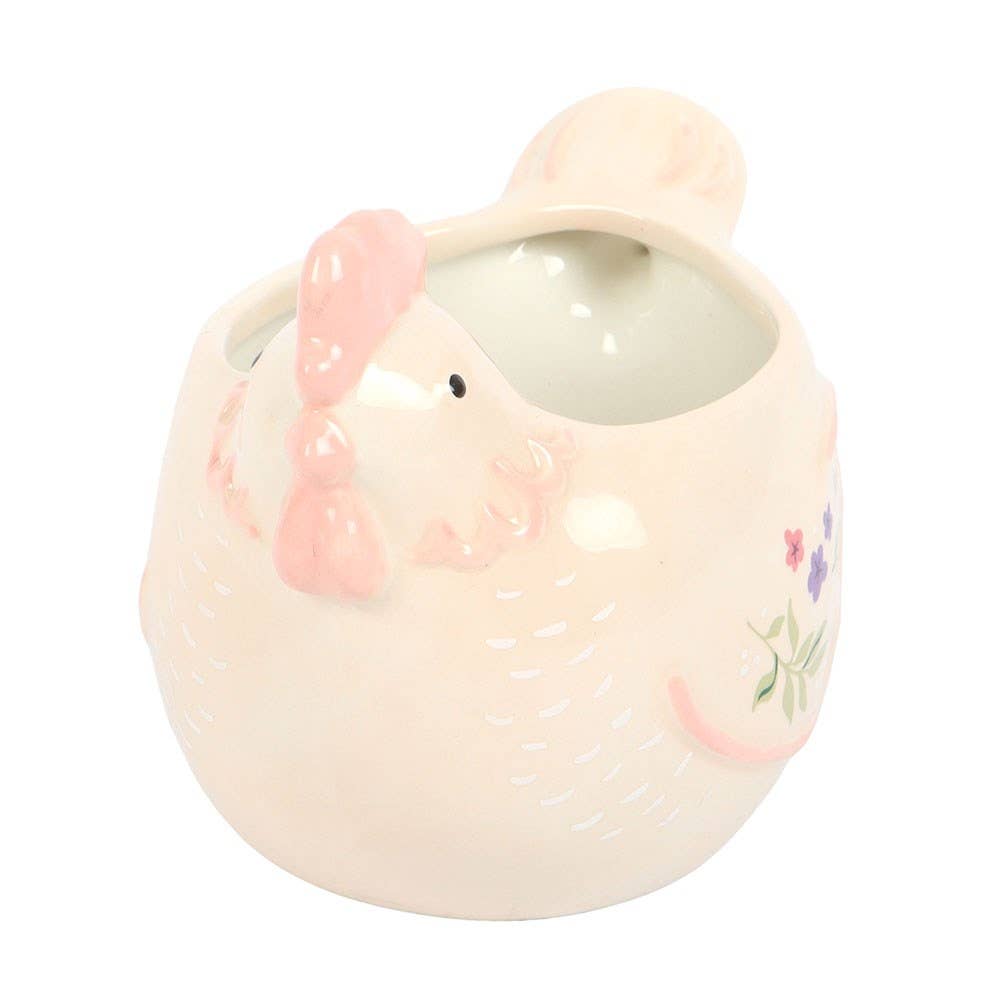 Ceramic Hen shaped container with a lid on a white background