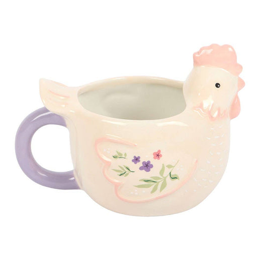 Ceramic mug shaped like a rooster with a floral design on a white background