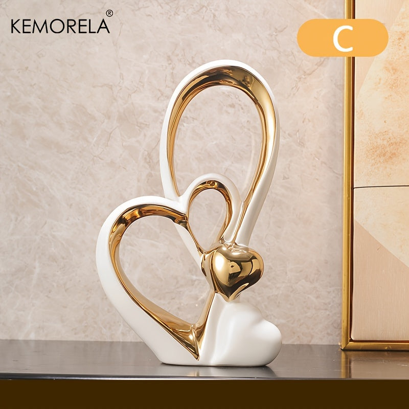 Decorative piece with two interlocking hearts, one gold and one white, on a neutral background.