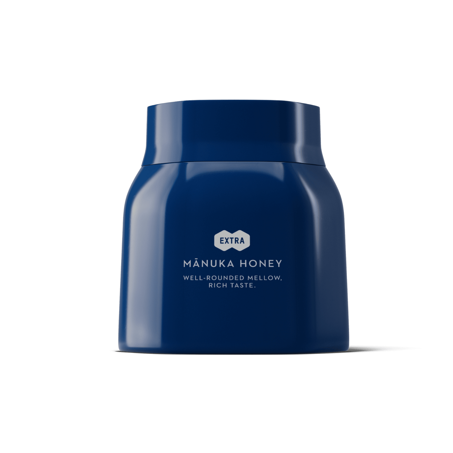 Blue jar of Manuka honey on a green background