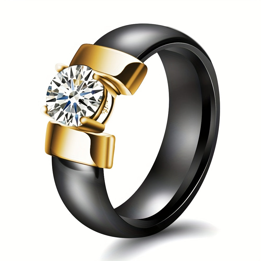 Ring with black band and gold accents featuring a diamond on a white background