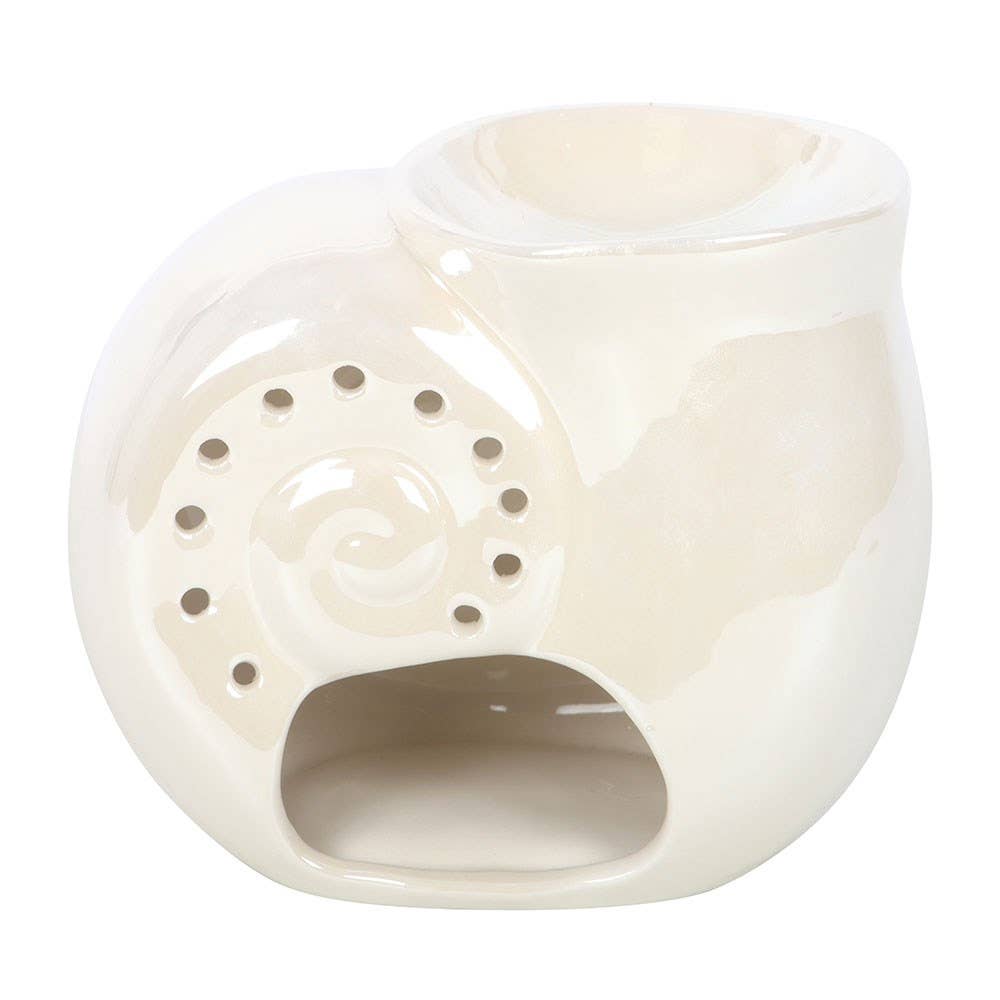 White ceramic oil burner with decorative design on a white background