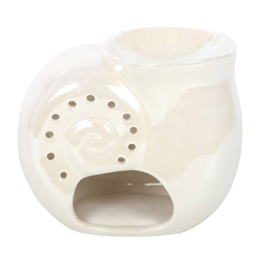 White ceramic oil burner with decorative design on a white background