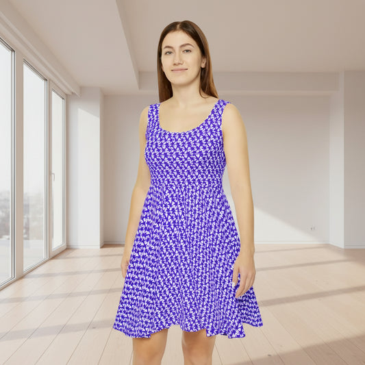Woman wearing a blue and white patterned dress on a white background