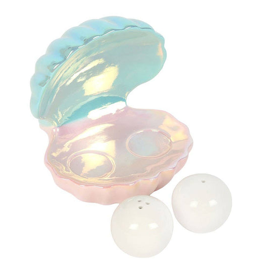 Iridescent shell with two pearls on a white background